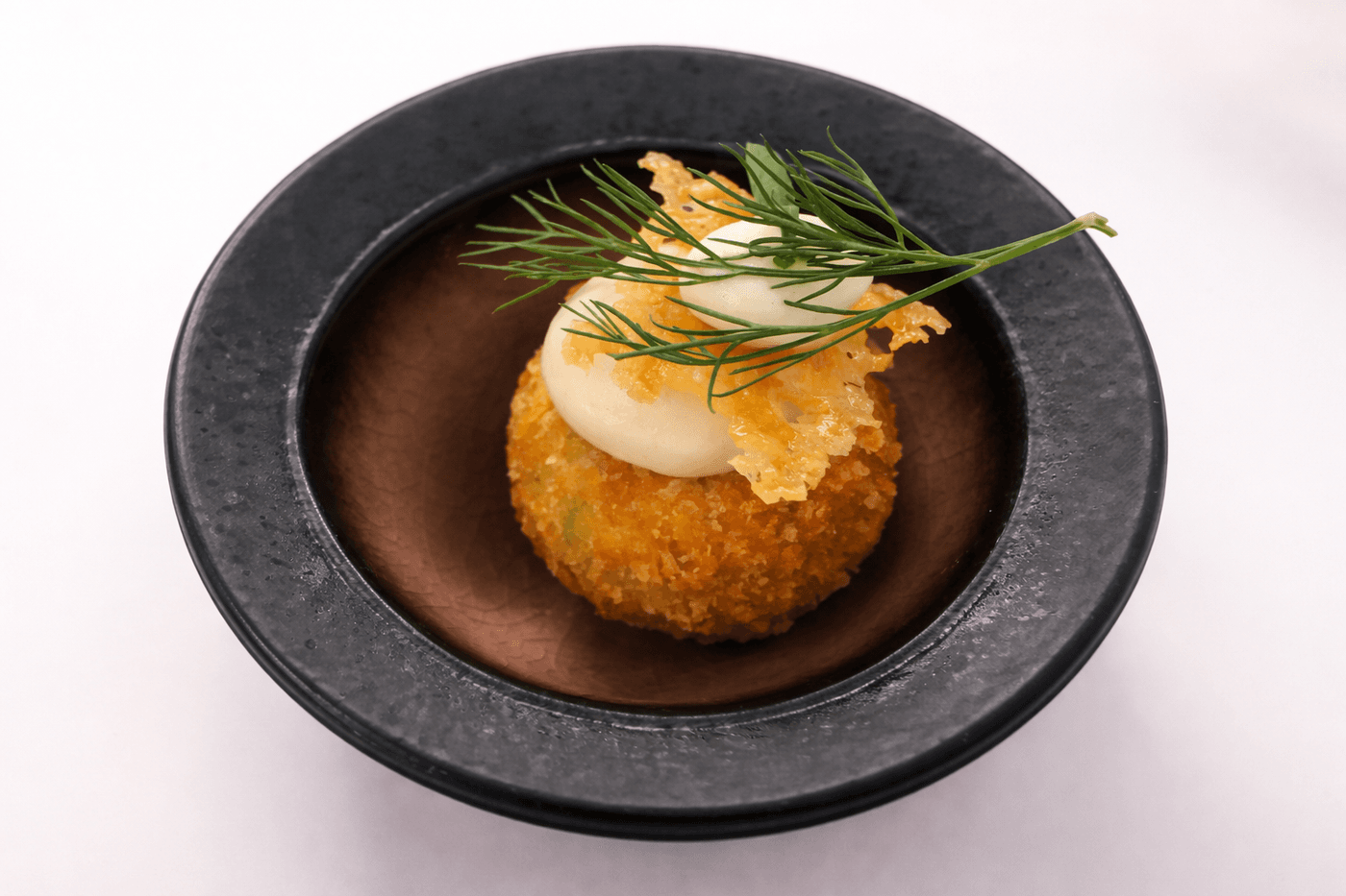 Fois gras arancini, truffled creme fraiche and parmesan crisp