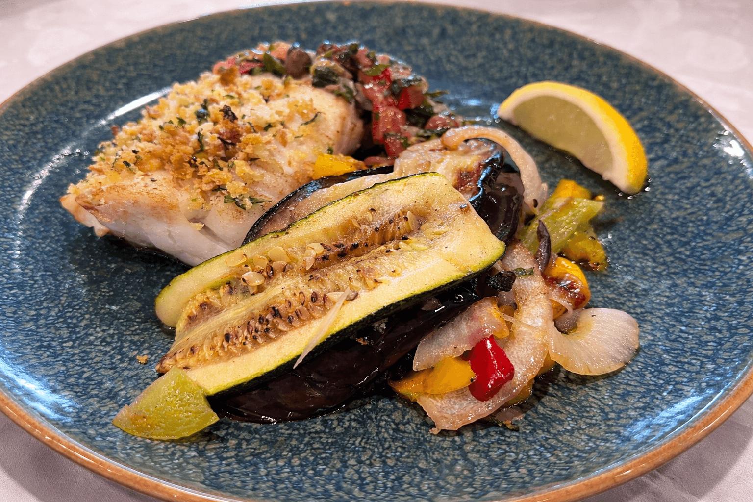 Seared cod loin with herb crumb served with Mediterranean vegetables