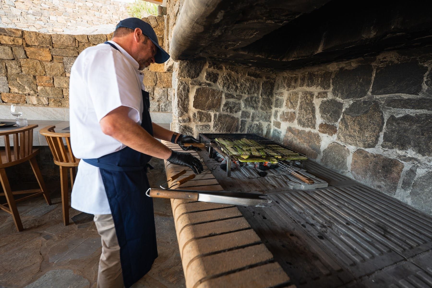 Chef at the outdoor stone grill