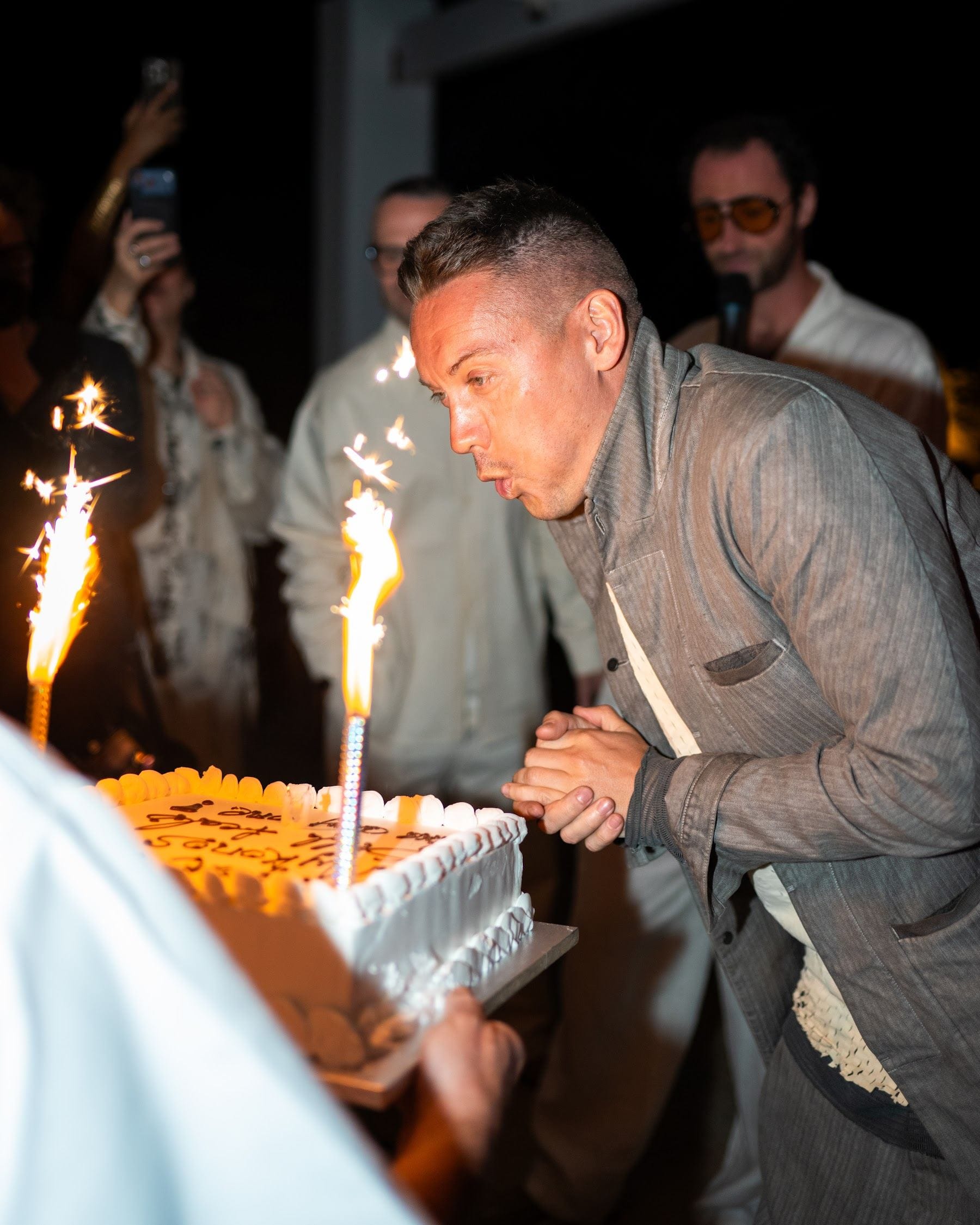 Birthday cake and sparklers at a villa evening