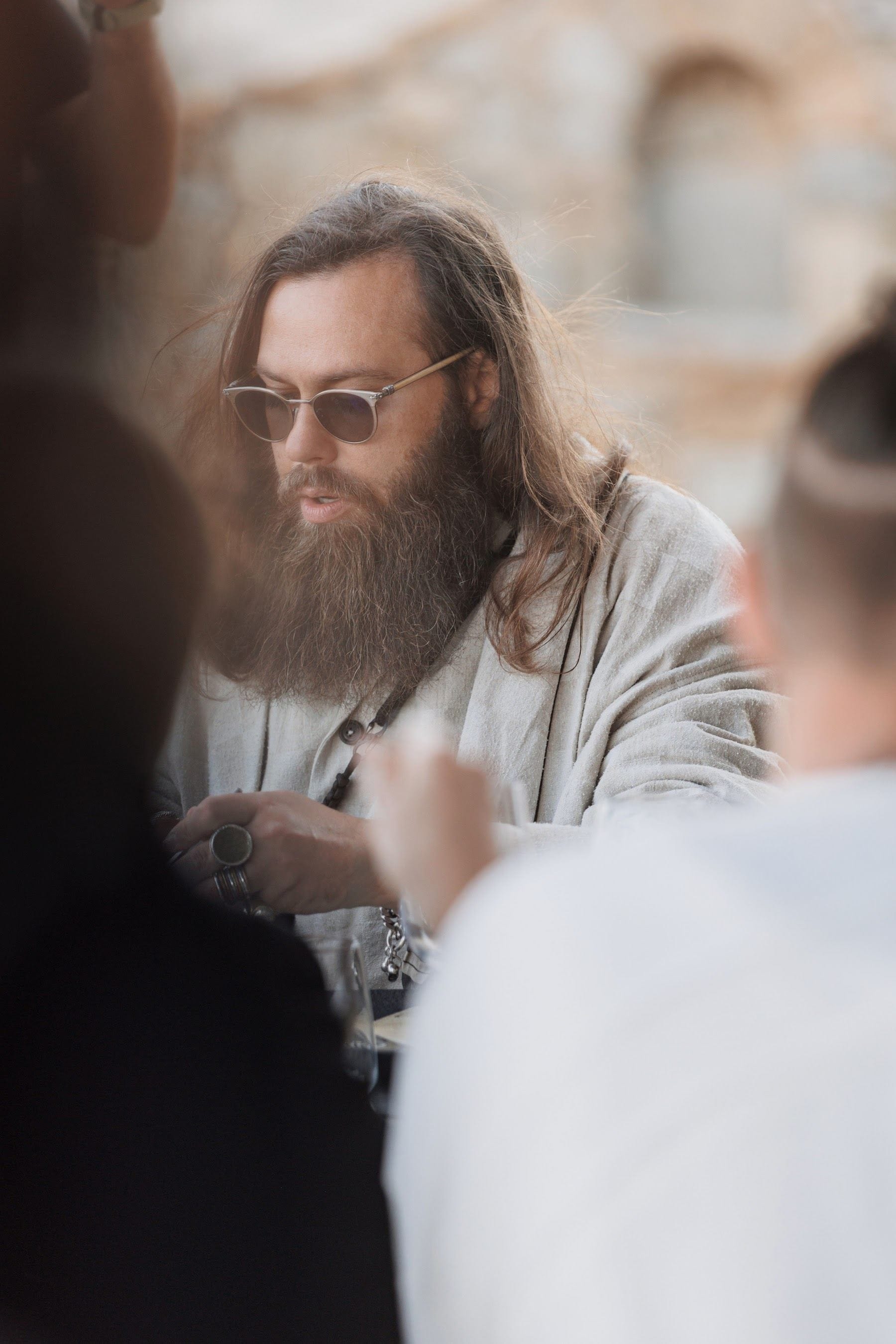 Guest in conversation over lunch, late afternoon light