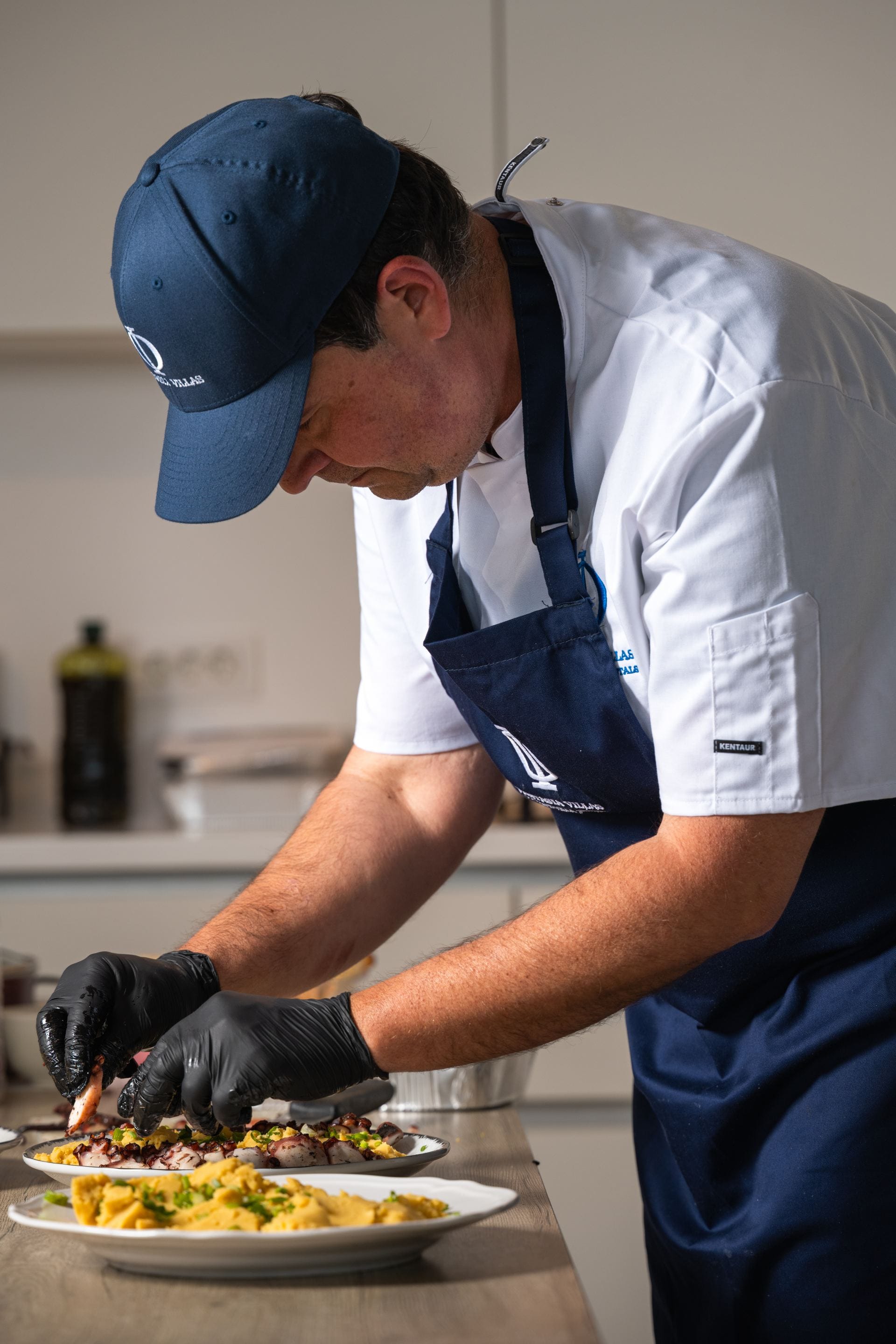 Fantasia Villas private chef plating a gourmet meal.