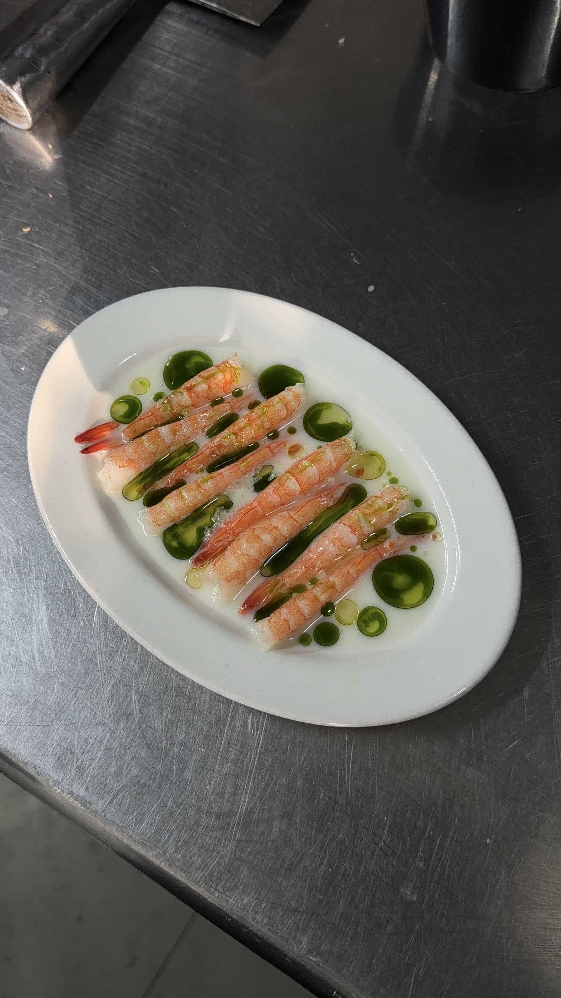 Amaebi, prawn butter milk crudo, herb oil, chilli oil, lemon pepper