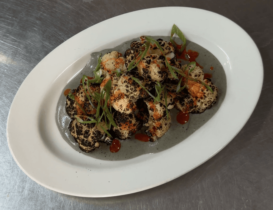 Dashi charred cauliflower, charcoal leek soubise, crispy chilli